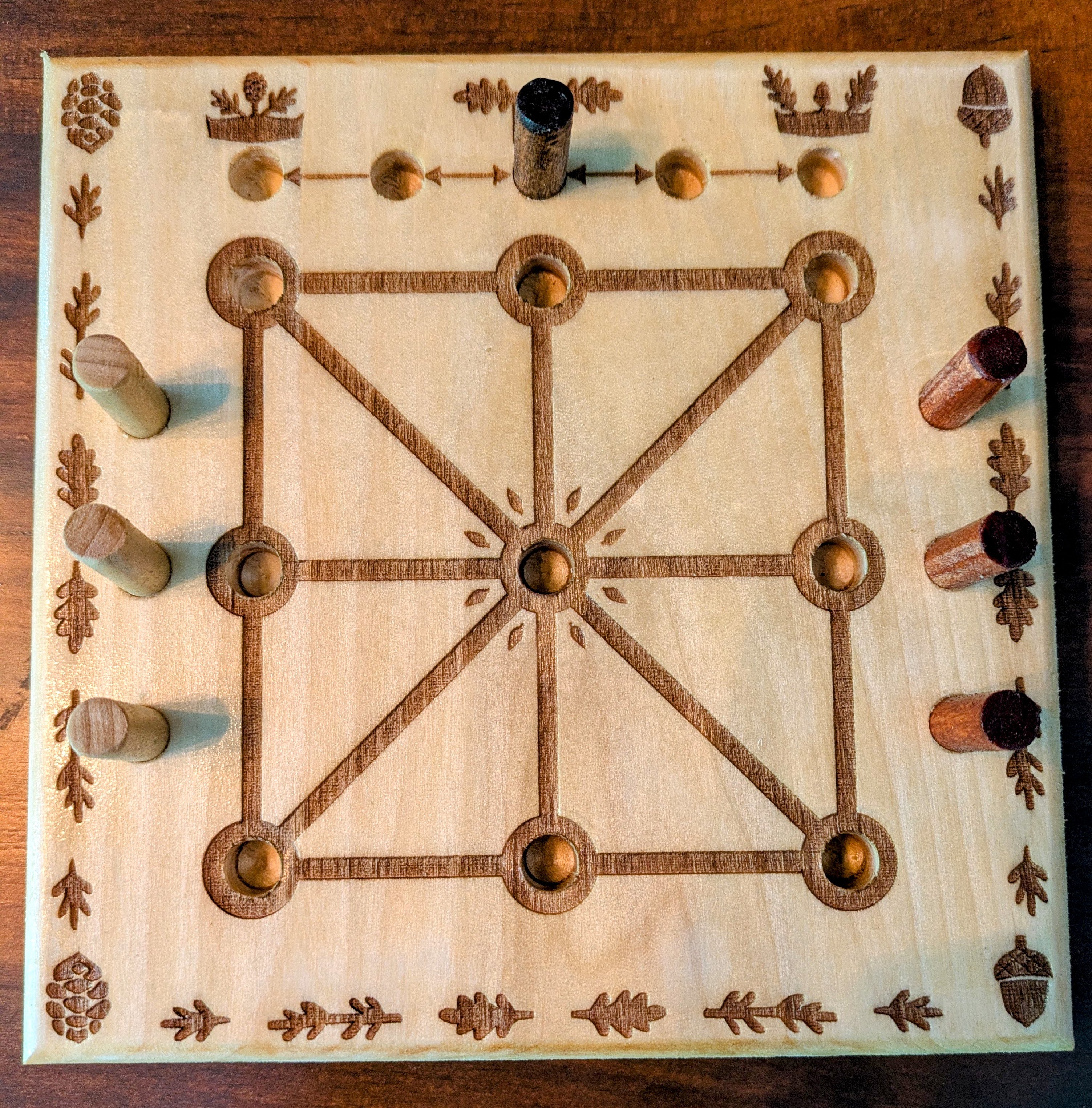 A wooden nature themed Three Men's Morris Board