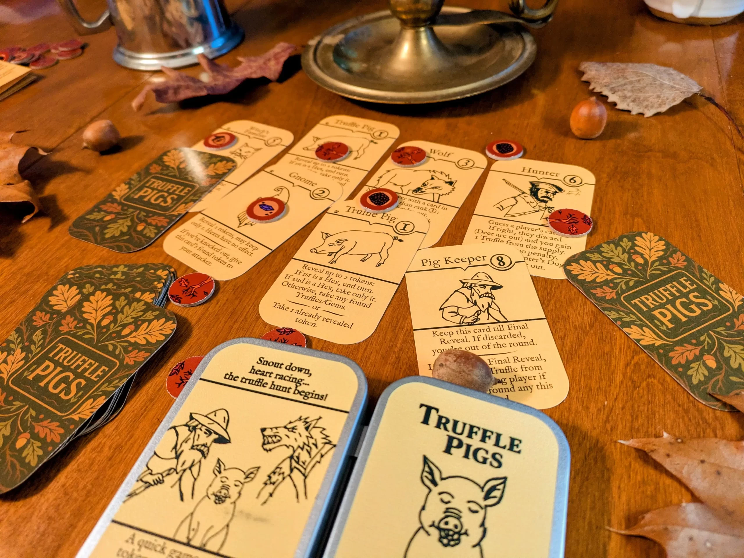 Truffle Pigs Card Game components spread out on the table